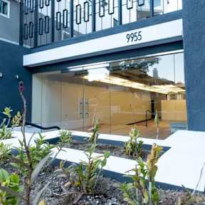 A modern building with the number 9955 on the facade.