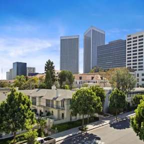 A cityscape with tall buildings and a clear sky.