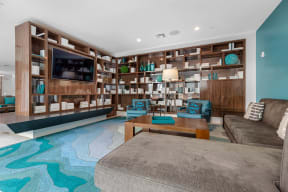 a living room with a couch and a coffee table and a television