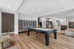 a game room with a pool table and a bar