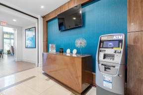 the lobby of a hotel with a parking meter and a television