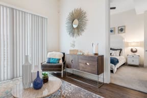 a living room with a couch and a dresser