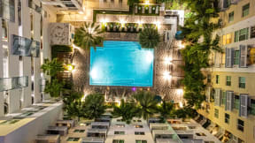 a hotel with a pool in the middle of a building