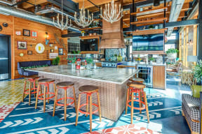 a bar with stools and a large counter in a restaurant