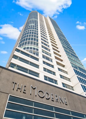 a tall building with a sign that reads the moderne