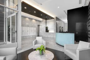 a lobby with a reception desk and chairs