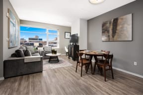 an open living room and dining room with a couch and a table