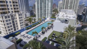 Rooftop lap pool with private cabanas and day beds
