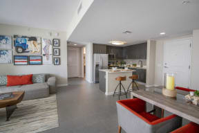 a living room with a kitchen and a dining room