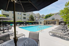 our apartments offer a swimming pool with chairs and umbrellas