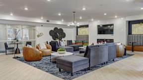Resident clubroom with ample seating at The Artisan at Robinson