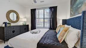 Large windows inside apartment bedrooms at The Artisan at Robinson