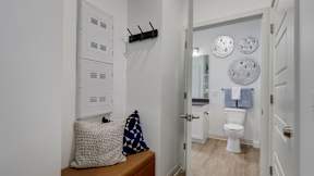 Furnished apartment home and modern bathroom at The Artisan at Robinson Apartments