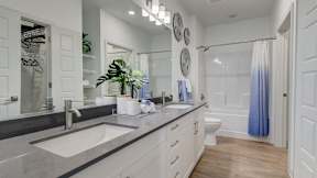 Double vanity inside apartment homes at The Artisan at Robinson Apartments
