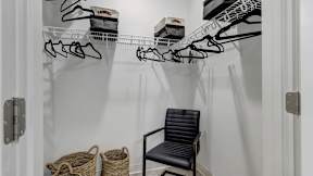 Spacious walk-in closets inside homes at The Artisan at Robinson Apartments