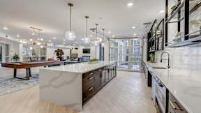 Large community kitchen and a billiards table at The Artisan at Robinson