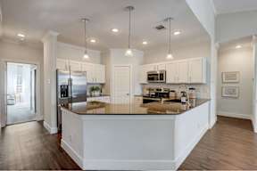 a kitchen with a counter top and a refrigerator