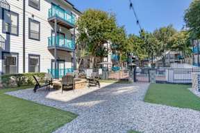 our apartments have a large yard with furniture and grass