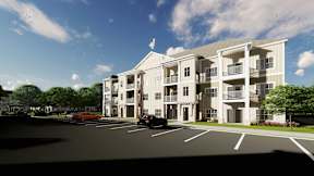 A modern apartment building with a parking lot in front.