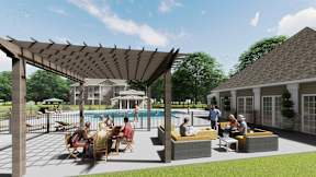 A group of people are sitting and standing under a pergola on a patio.