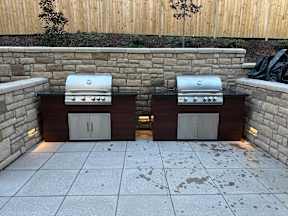 Two grills are built into a wall.