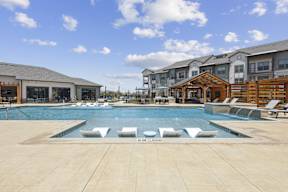 resort inspired pool with sundeck tanning ledge