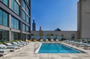 Sparkling Pool Deck with Lounge Chairs at Landmark West Loop Apartments in Chicago, IL