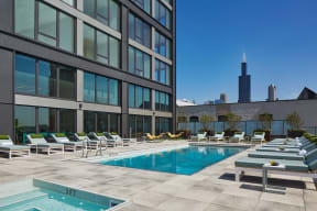 Sparkling Pool Deck with Lounge Chairs at Landmark West Loop Apartments in Chicago, IL
