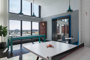 Poolhouse with Ping Pong & Shuffleboard Games overlooking Pool Deck & Skyline Views at Landmark West Loop Apartments in Chicago, IL