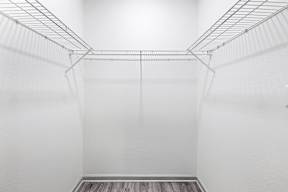 Empty white shelving unit in a room.