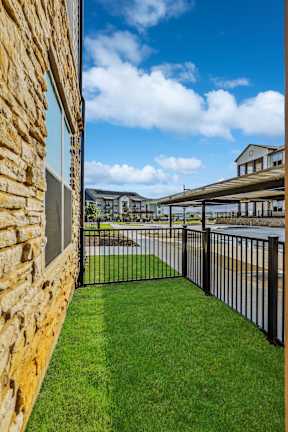 Apartments with yards with real grass and fenced in