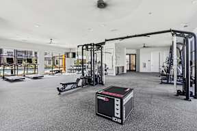 spacious fitness center with cardio and weight training equiptment