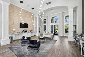 A living room with a television, couches, and a rug.