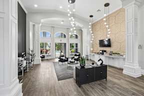 A modern living room with a black and white color scheme.
