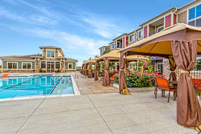 A pool area with a clear blue sky in the background.