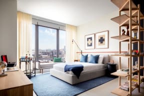 Bedroom Area in Studio Apartment with Floor to Ceiling Windows at Landmark West Loop Apartments in Chicago, IL