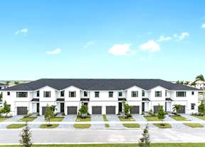 a group of white houses with black roofs