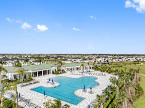 an aerial view of a swimming pool and resort