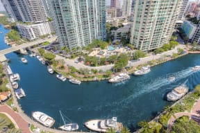 an aerial view of a harbor with boats and tall buildings
