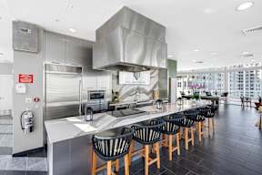 Sky Lounge Kitchen with a long counter and chairs.