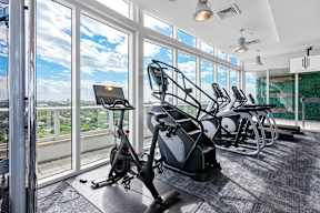 A gym with a view of the city.