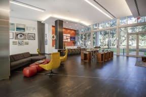 a living room with a couch and a table and a large window