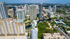 a view of a city with tall buildings and a river
