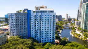 an aerial view of a city with a river and tall buildings