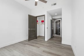 a renovated living room with white walls and wood flooring