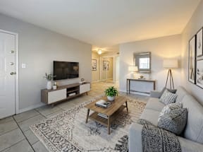 Open living area with easy-care tile flooring at Los Cedros Apartments in Brownsville, Texas.