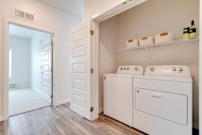 A laundry room with a washer and dryer.