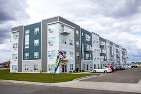 Flats on 21 Exterior with Now Leasing Banner