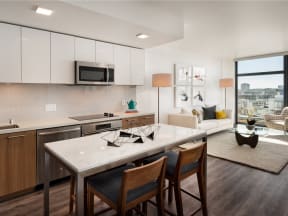 interior kitchen with premium appliances, floor to ceiling windows, natural light, spacious floorplan