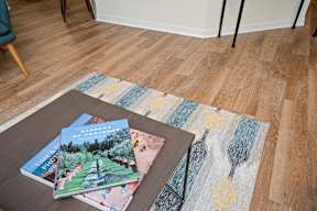 Coffee Table with Books at Harbor Village at the Commons, Wakefield